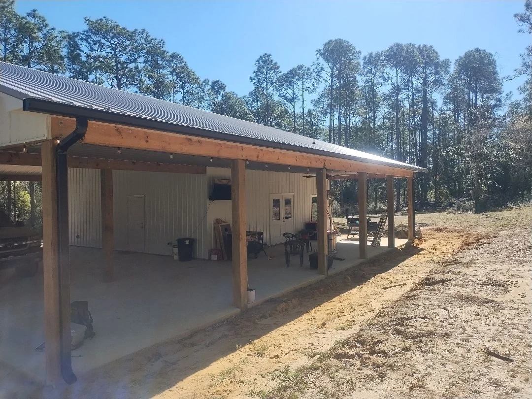 Covered patio roofline with gutter and downspout work.